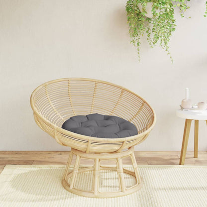 Coussin rond anthracite présenté sur un siège dans une ambiance décorative, siège non inclus.