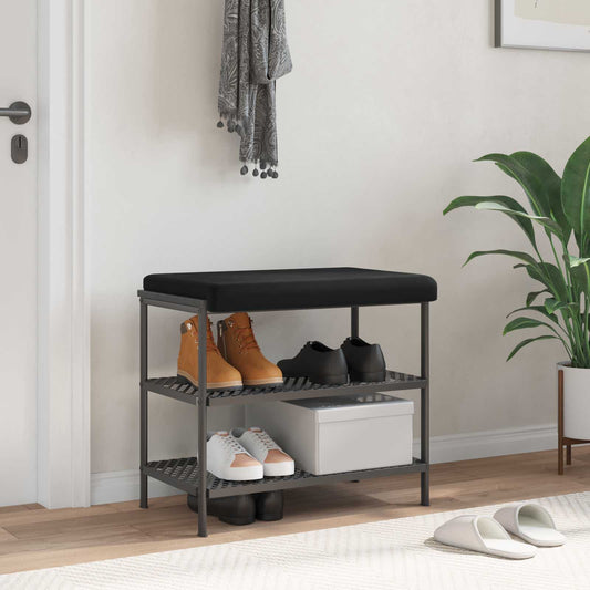 Détail du coussin en velours noir posé sur un banc bois et métal, banc non inclus.
