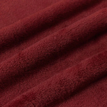 Texture et plis du tissu de la couverture bordeaux