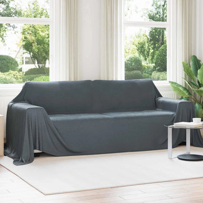 Couverture XXL, coloris gris foncé, drapée sur un canapé blanc