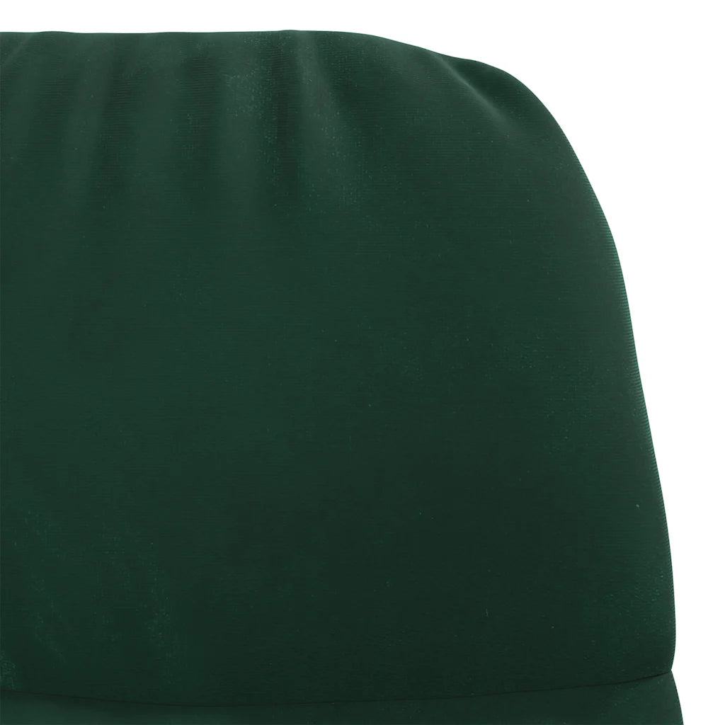 Gros plan sur le dossier et les coutures du fauteuil à bascule en velours vert foncé.