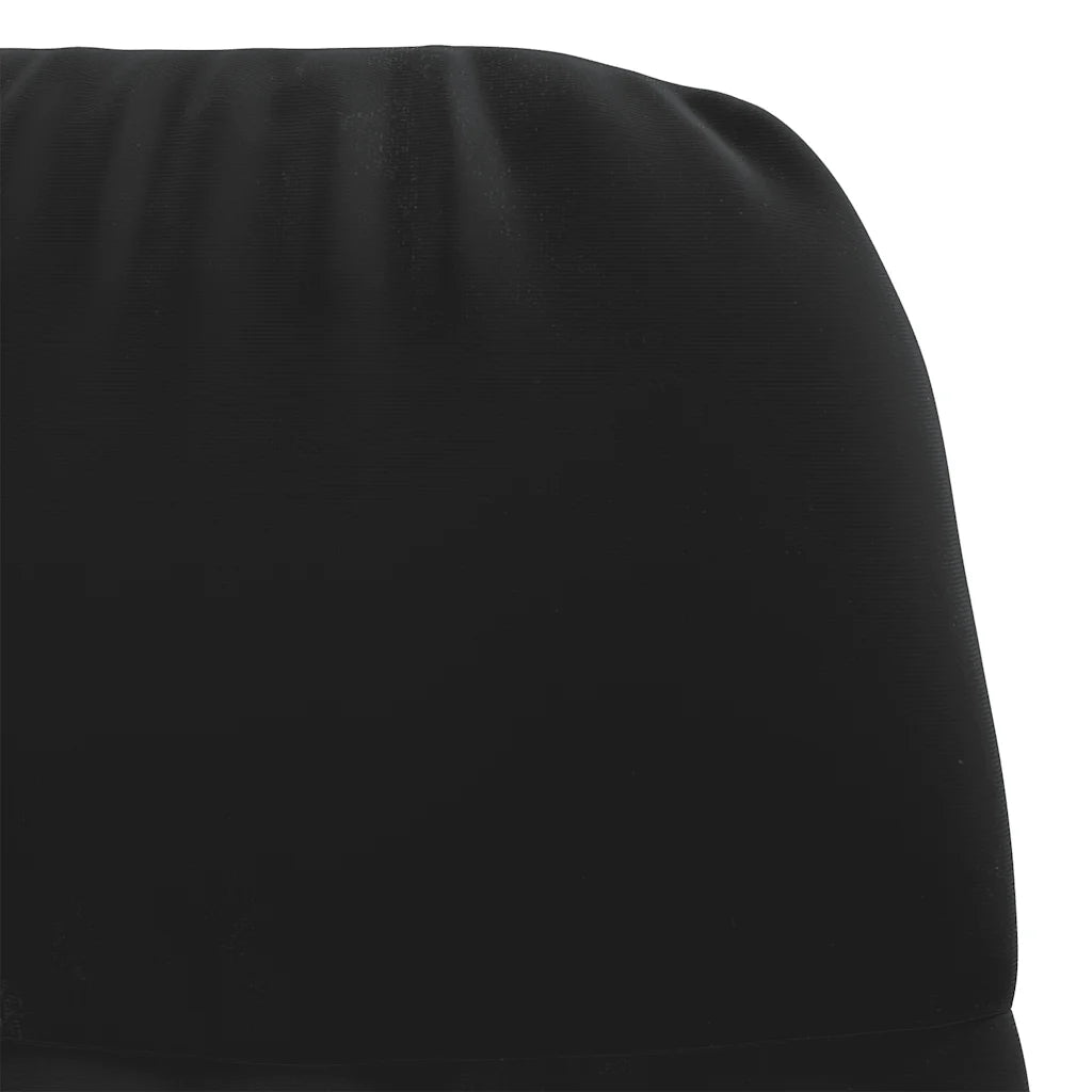 Gros plan sur le dossier rembourré et les coutures du petit fauteuil à bascule en velours noir.