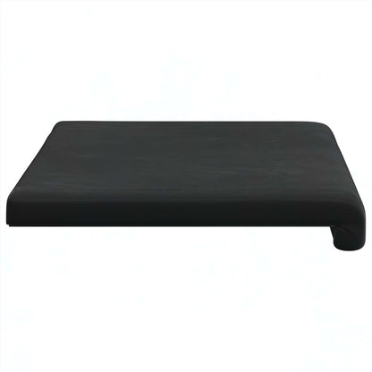 Profil du coussin noir montrant la forme en L et le retour au bord de l’assise.