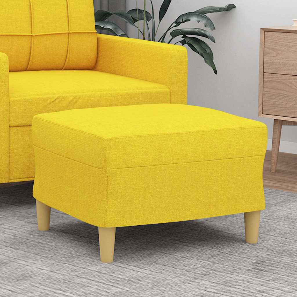Repose-pieds jaune clair en tissu, en situation dans le salon