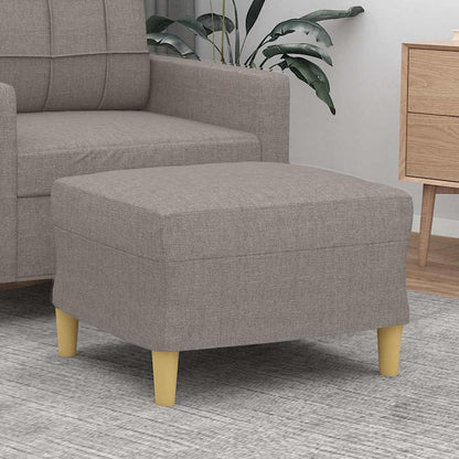Repose-pieds taupe en tissu, en situation dans le salon