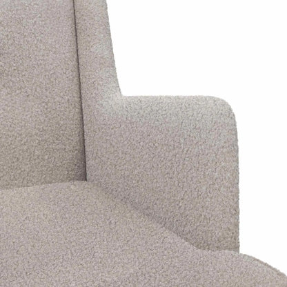 Vue de profil du rocking chair gris clair en bouclé et de ses patins incurvés en bois.