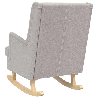 Vue arrière du rocking chair gris clair, montrant le dossier en bouclé et les patins en bois.