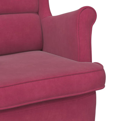 Détail de l’assise, du dossier et de l’accoudoir en velours rouge vin du fauteuil.