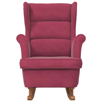 Vue de face du rocking chair rouge vin, avec dossier haut et accoudoirs rembourrés.