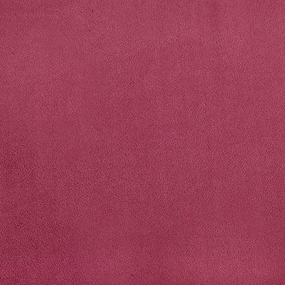 Gros plan sur la texture du velours rouge vin du rocking chair.